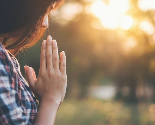 Peaceful woman outdoors, thinking about delta 8 THC